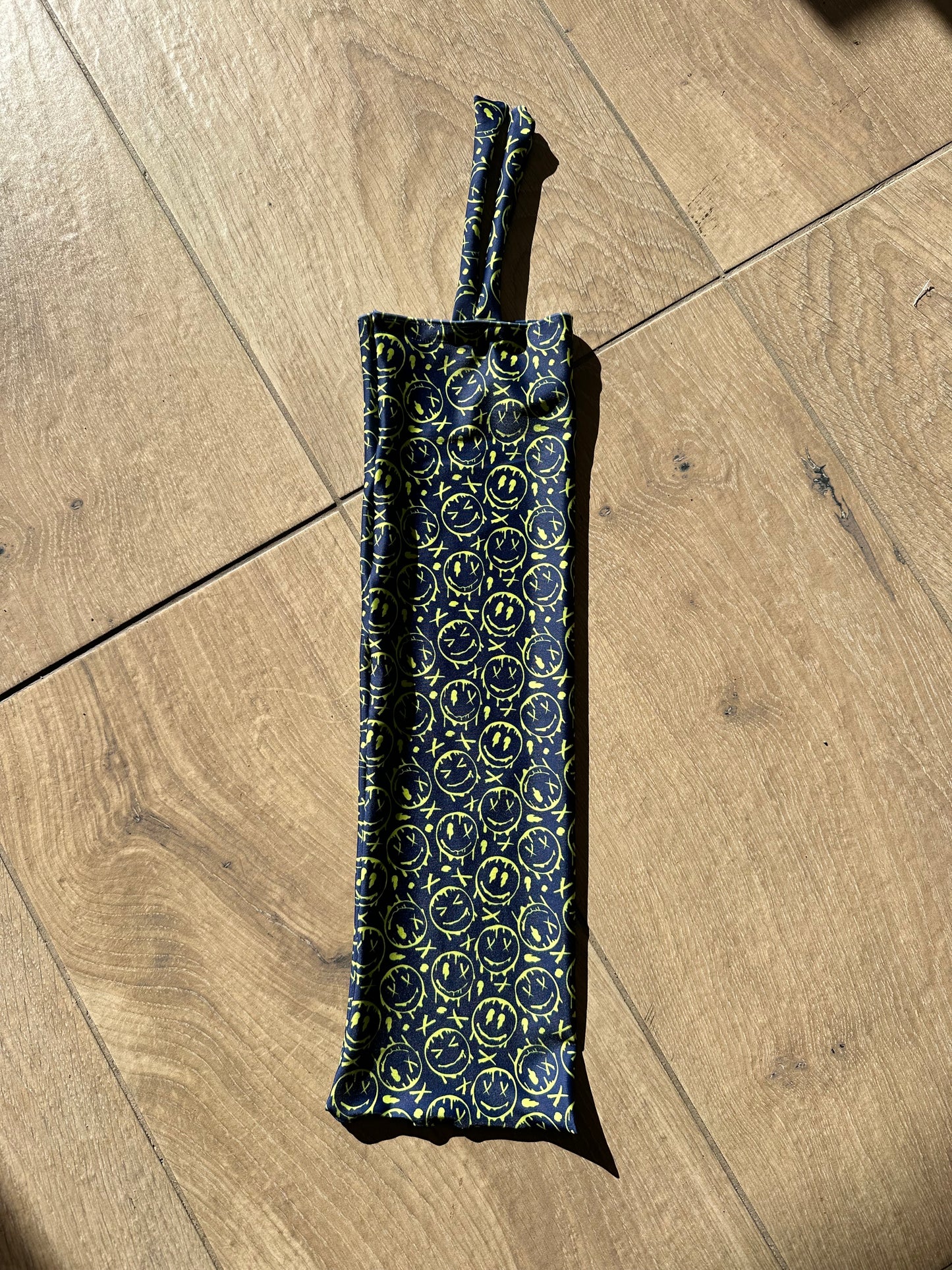 Graffiti Faces Tie-in Tail Bag